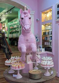 A pink carousel horse, and beautiful soap cakes. 